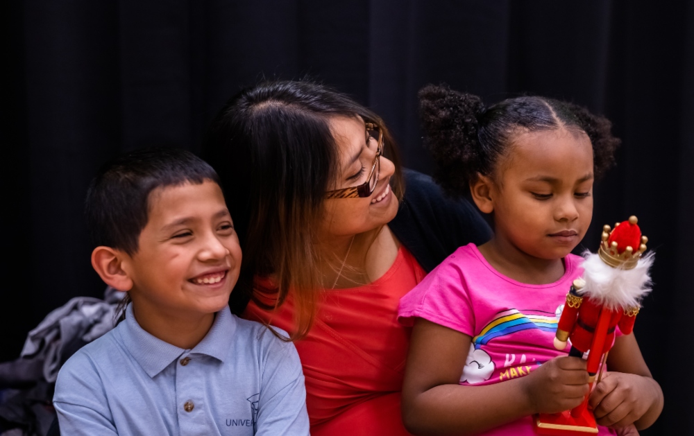 Gloria, an advocate for youth housing, former foster youth, and Bridging the Gap participant is pictured with her two children - Mile High United Way