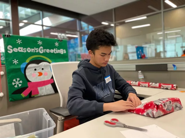 Volunteers wrapped gifts for 1300 children at Children's Holiday Party 2022