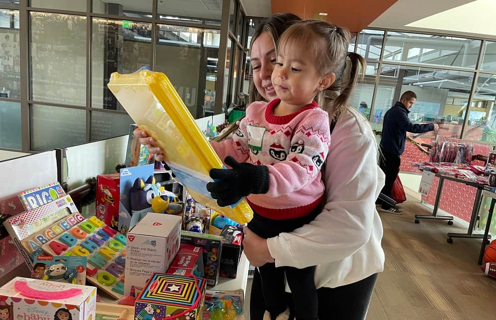 Children receiving toys at Mile High United Way's Children's Holiday Party